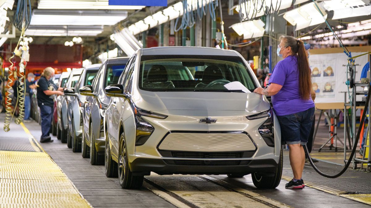 Employees assemble Chevrolet Bolt EUVs.