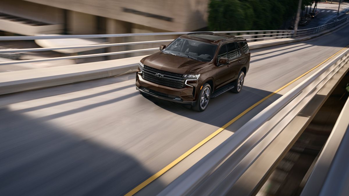A 2023 Chevrolet Tahoe driving.