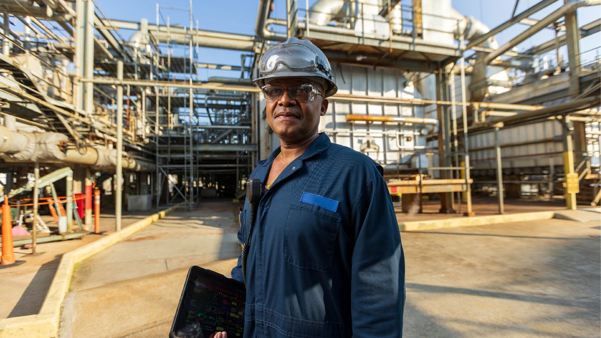 Man in city uniform on industrial site