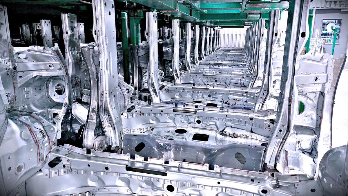 Steel vehicle body panels at a Mercedes-Benz assembly plant.