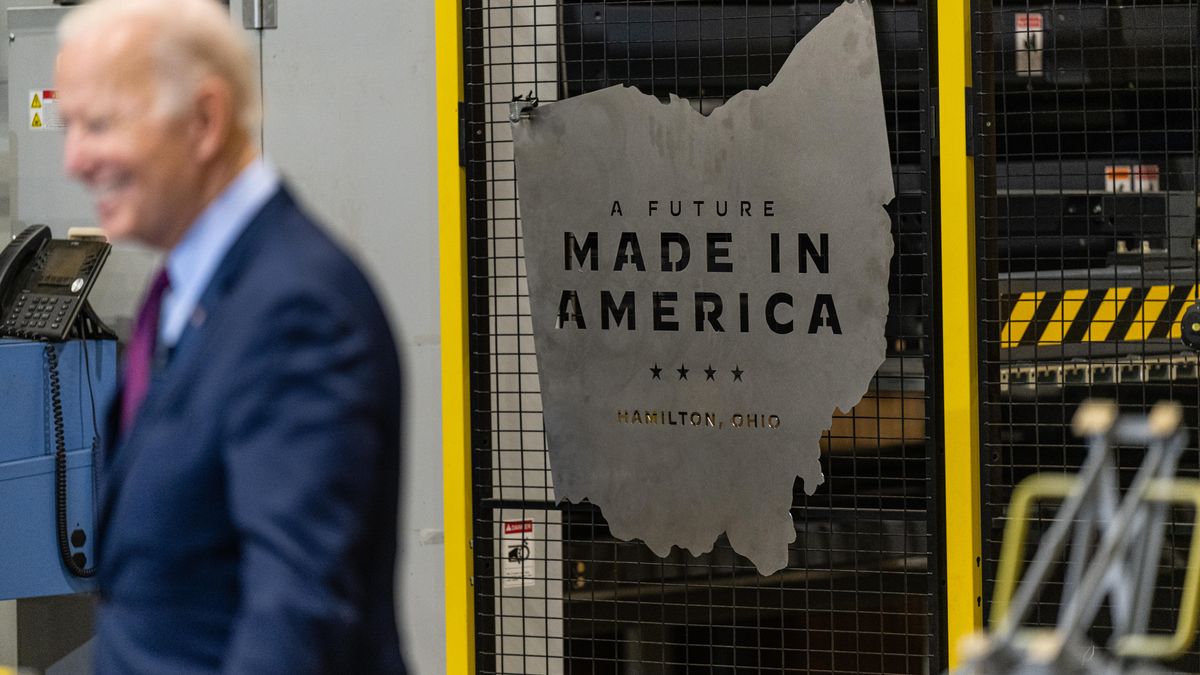 A Future Made in America sign is seen as U.S. President Joe Biden stands in a manufacturing demonstration area at United Performance Metals on May 6, 2022 in Cincinnati, Ohio