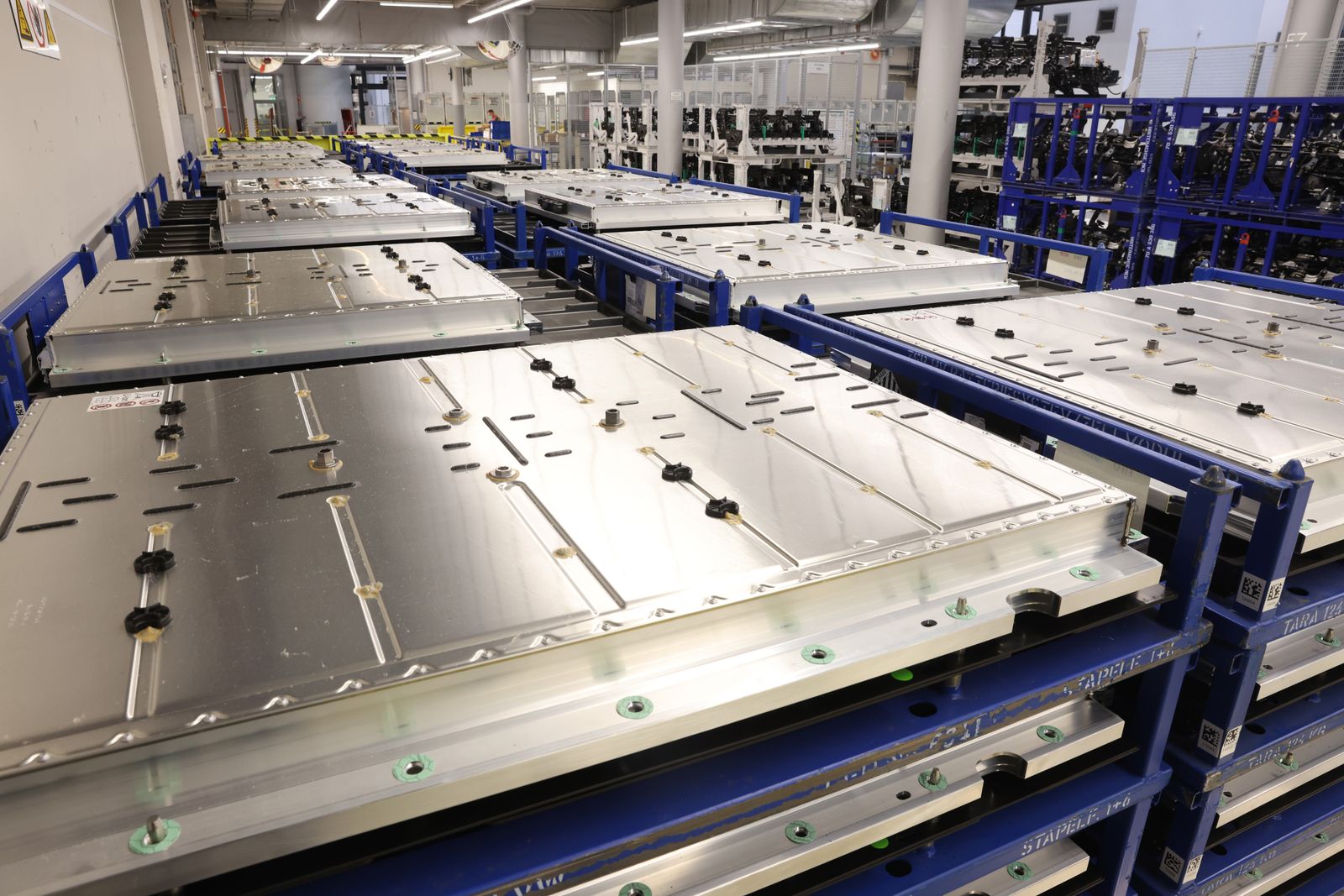 Rows of EV batteries in a manufacturing facility in Germany