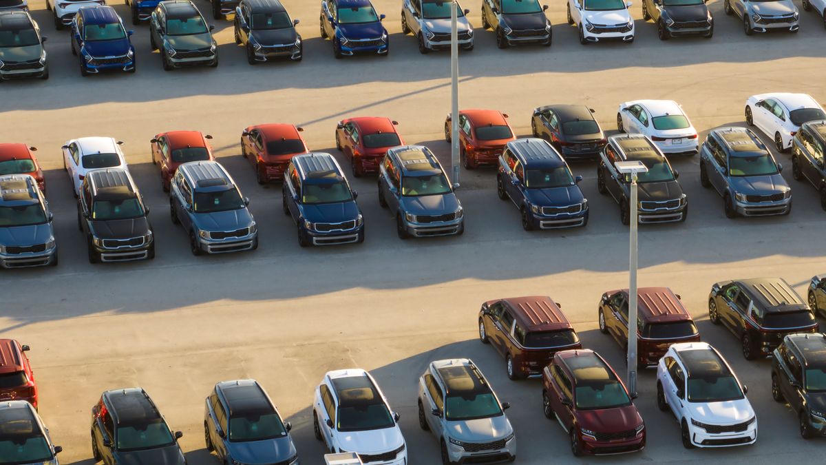 New cars parked at a dealership.