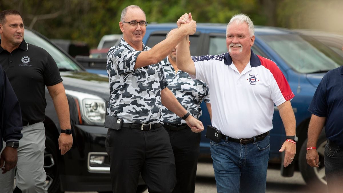 UAW President Shawn Fain greets striking union members outside the General Motors Lansing Delta Assembly Plant in Michigan.