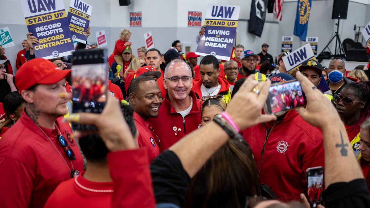 UAW President Shawn Fain greets union members at a rally in Chicago, Illinois.