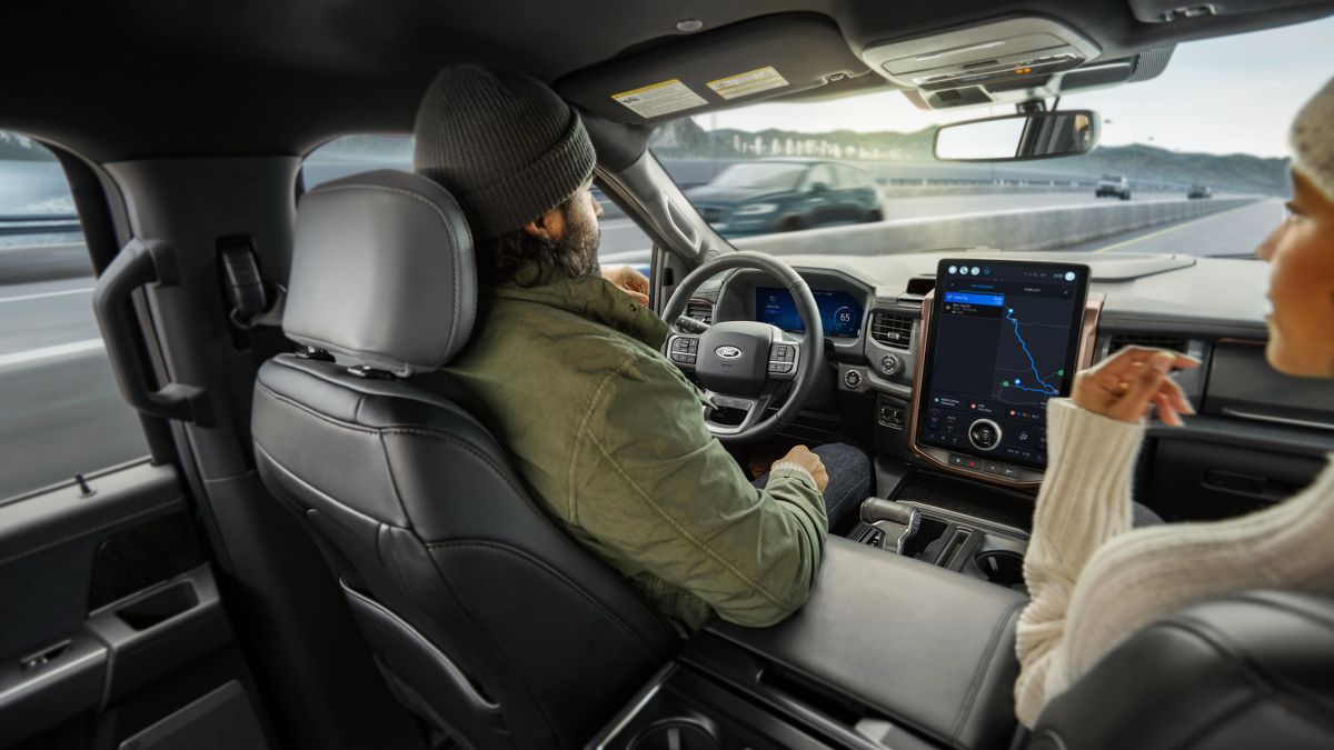 A driver using Ford's BlueCruise hands-free driver assist technology.