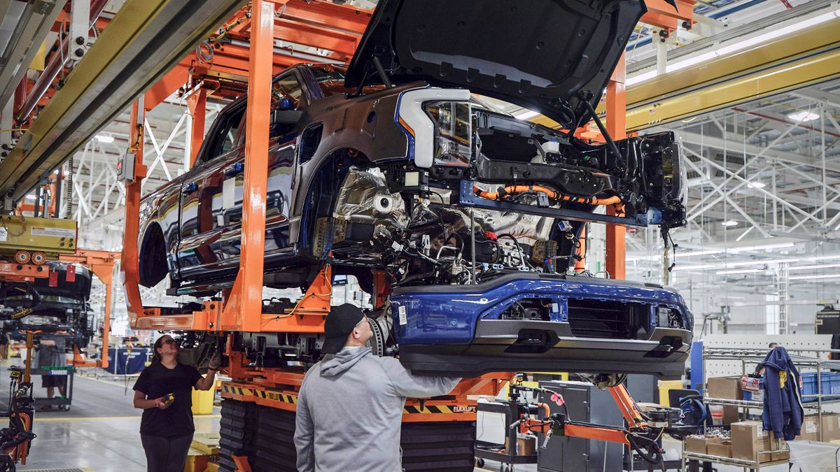 Workers assemble a Ford F-150 Lightning at the company's Rouge Electric Vehicle Center in Michigan.